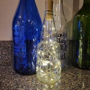 Lighted upcycled small clear bottle for Decor